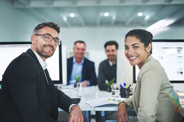 Success is the product of teamwork. Shot of corporate colleagues working together in their office.