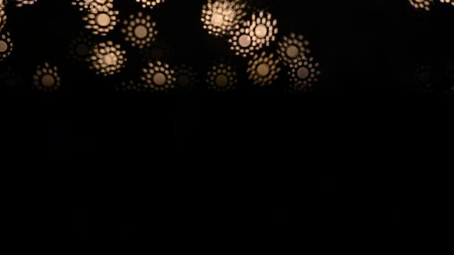 Abstract blurry, low depth of field bokeh light shapes. Vivid, colourful light effects, 4K background video clip with different shapes and dots in various colours. Perfect for Christmas backgrounds