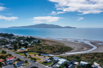 waikanae beach at Waimea Stream showing the stream mouth with Kapiti Island in the distance. this...