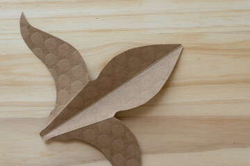 decorative paper shape on wood