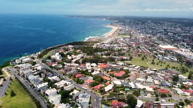 Aerial drone shot of landscape view of Bar Beach Merewether Newcastle rural houses Tourism Pacific Ocean NSW Australia 4K