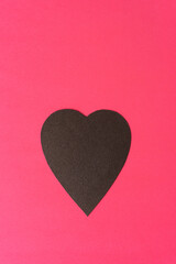 background design with paper heart on hot pink