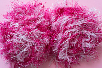 variegated pink and white thread or fringe yarn on pink paper