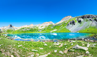 Panoramic view of beautiful Ice lake near Silverton, Colorado on rocky mountain peak and panorama reflection of summer landscape with nobody and green grass blue sky - obrazy, fototapety, plakaty