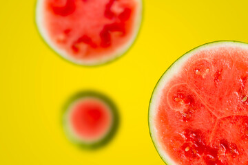 Fresh and juicy watermelon fruits on yellow colorful background. Tasty melon slices in the summer....