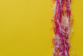 background with thread like yarn on yellow