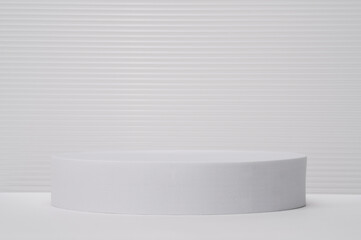 Blank and empty platform. White podium for presentation. Light exhibition stand with minimal white and grey background. Elegant product presentation.