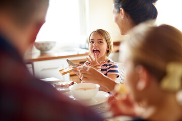 Having fun at the breakfast table. Shot of a family having breakfast together.