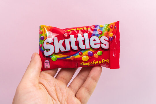 Tyumen, Russia-December 27, 2021: Original Skittles brand candies. Multicolored background. delicious sweet skittles