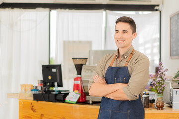 Fototapeta premium Young man cafe owner standing in front of the shop smiling happily, food and drink concept.