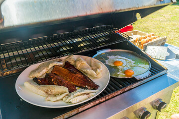 Tasty grilled fish and eggs
