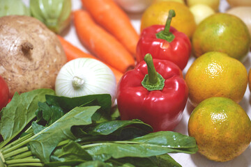 Fresh fruits and vegetables. Nutritious food. Vegetarian Food. Basic food. Carrot, orange, red pepper, yellow pepper, broccoli, white onion, purple onion, spinach, nopales, tomato, green bean, chard, 