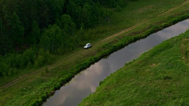 Aerial view of a car on the river bank