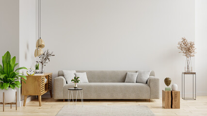 Empty living room with sofa have plants and table on empty white wall background.