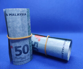 Fototapeta premium Rolls of paper denominated in Ringgit Malaysia 50.