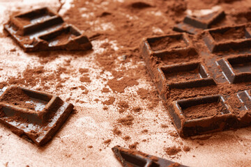 Broken chocolate bar and cocoa powder. 割れた板チョコとココアパウダー