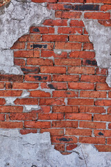Old structural brick wall texture with cracks and cement, vertical background in high resolution