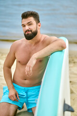 Man with kayak spending time on a beach