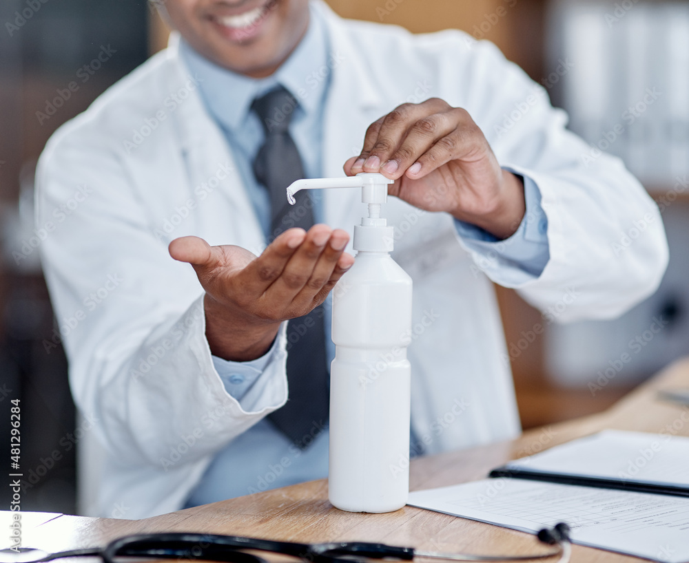 Aufkleber sanitise as often as possible. closeup shot of an unrecognisable doctor using hand sanitiser while w