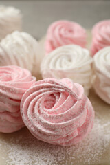 Obraz na płótnie Canvas Delicious pink and white marshmallows on wooden table, closeup
