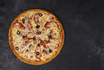 pizza on a dark  board