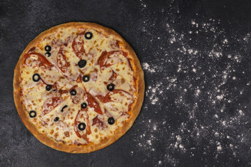 pizza on a dark board