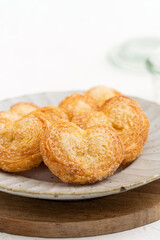 Delicious Palmier butterfly pastry in heart shape for Valentine's day dessert.