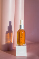 Obraz na płótnie Canvas Natural essential oil or serum in brown glass bottle. Alternative medicine, beauty skin care product