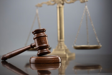 Law symbols composition. Law and justice concept.  Gavel and scale on gray background.