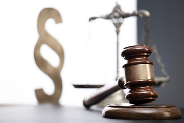 Law symbols composition. Law and justice concept.  Gavel and scale on gray background.