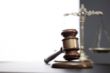 Law symbols composition. Law and justice concept.  Gavel and scale on gray background.