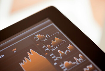 Checking Business Market Flow on a Digital Tablet