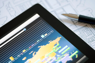Business Investment Report on a Digital Tablet