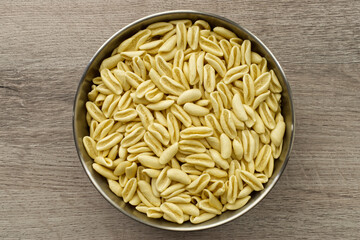 Traditional uncooked Italian Cavatelli. Cavatelli are a type of short pasta typical of Southern Italy, prepared only with semolina flour and water. Top view