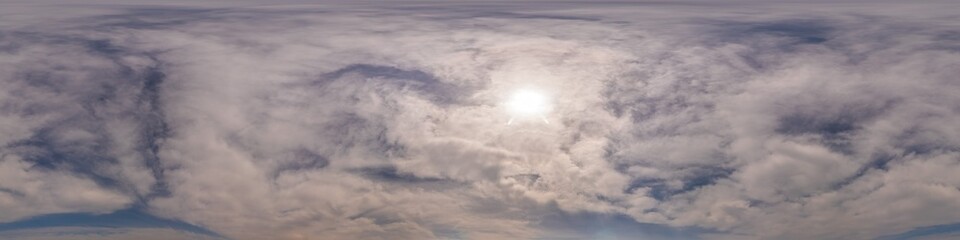Obraz premium Blue sky panorama with Cirrus clouds in Seamless spherical equirectangular format. Full zenith for use in 3D graphics, game and editing aerial drone 360 degree panoramas for sky replacement.