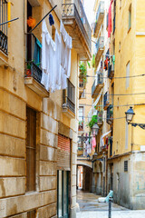 Fototapeta na wymiar Scenic balconies of old houses in the Gothic Quarter, Barcelona