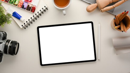 Creative workplace flat lay mockup with tablet white screen mockup.
