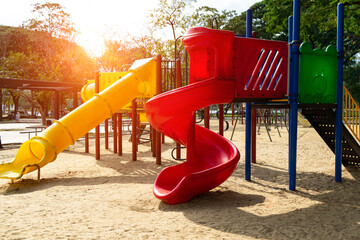 Colorful children playground,exercise kid,activities in outdoor public park surrounded by green...