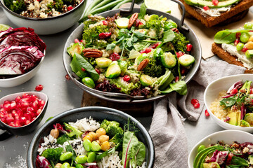 Vegan dishes assortment on gray background.