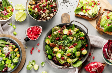 Vegan dishes assortment on gray background.