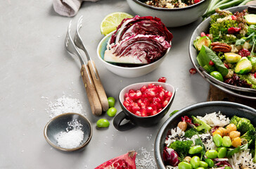 Vegan dishes assortment on gray background.