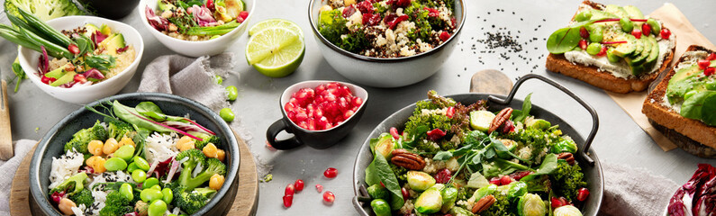 Vegan dishes assortment on gray background.