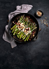 Warm salad with asparagus, cheese, nuts