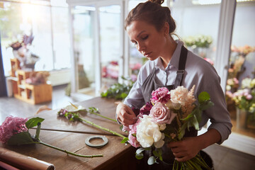 Florist with fresh pink bouquet