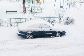 snow covered car after big snowfall