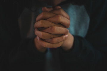 Woman hands praying to god with the bible. begging for forgiveness and believe in goodness. Power of hope or love and devotion.