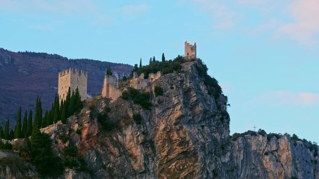 Arco castle on rocky cliff horizontal pan of Trentino Alto adige - Trento - Italy landmarks