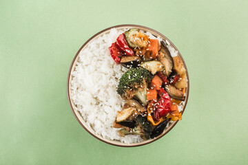 A bowl with grilled rice and vegetables