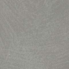 rough surface texture of sand screed cement wall with uneven stains and tiny holes.