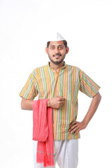Young indian farmer in traditional wear and giving expression on white background.